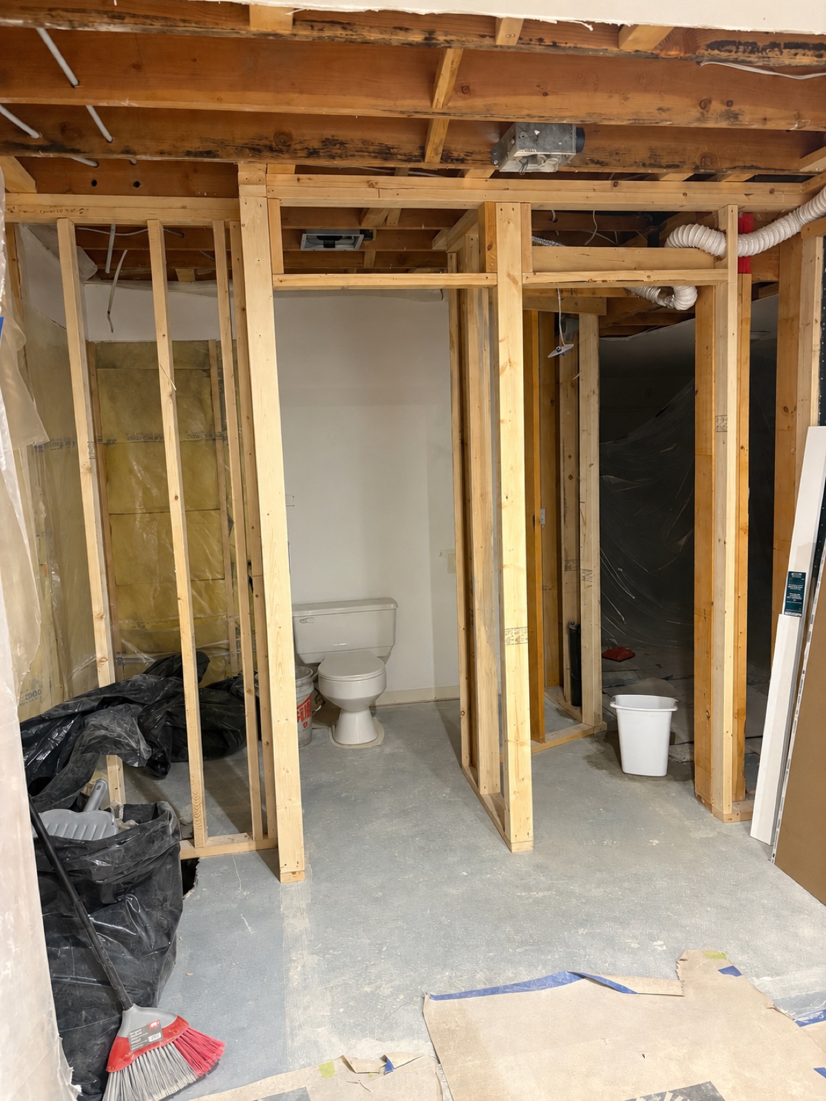 Bathroom framing in progress, ceiling joists exposed
